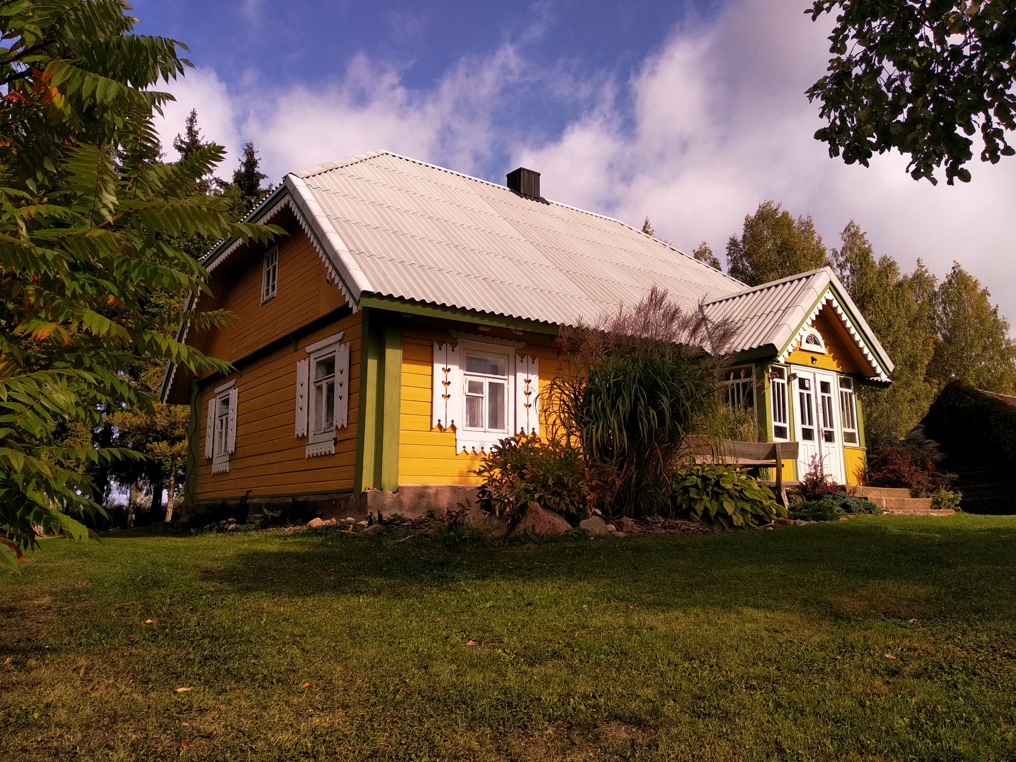 The farmhouse and flowerbeds